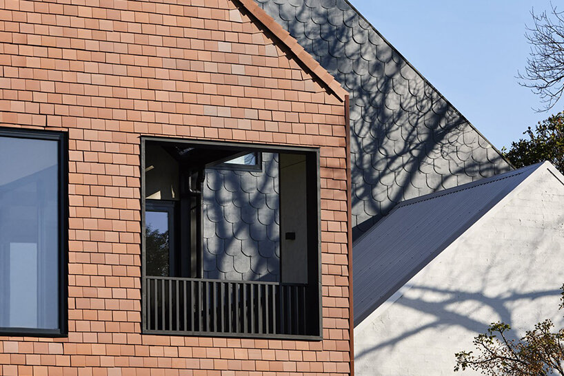 austin maynard disguises fourteen-unit ‘slate house’ as a small dwelling in melbourne