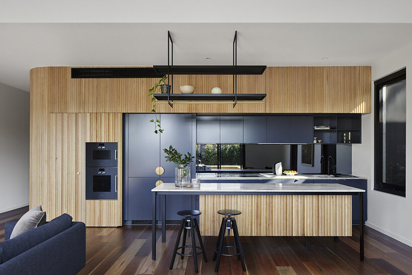 austin maynard disguises fourteen-unit ‘slate house’ as a small dwelling in melbourne
