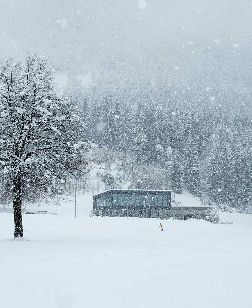 cross-country skiing center blends with the surrounding alpine landscape