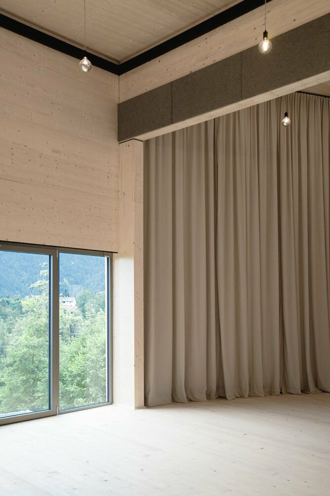 regional larch wood makes up sustainable mobile concert hall in austrian hillside