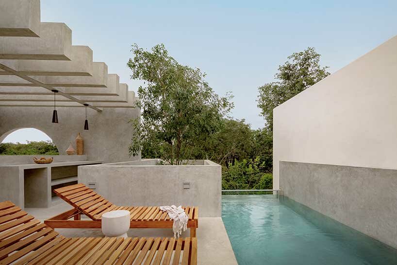 a habitable sculpture: espacio 18 infuses brutalist-inspired villa in mexico with lush greenery
