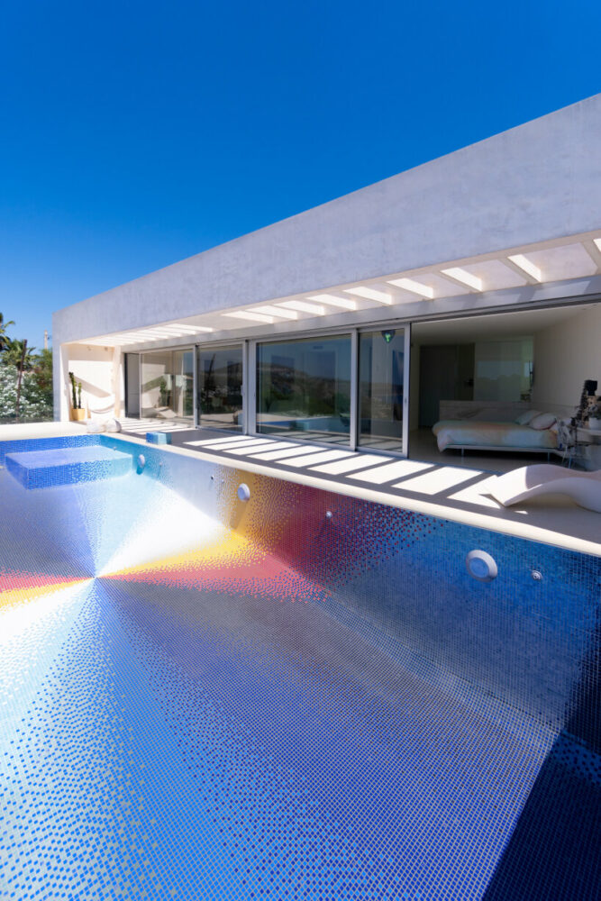 felipe pantone pixelates residential swimming pool with 130,000 rainbow glass mosaics