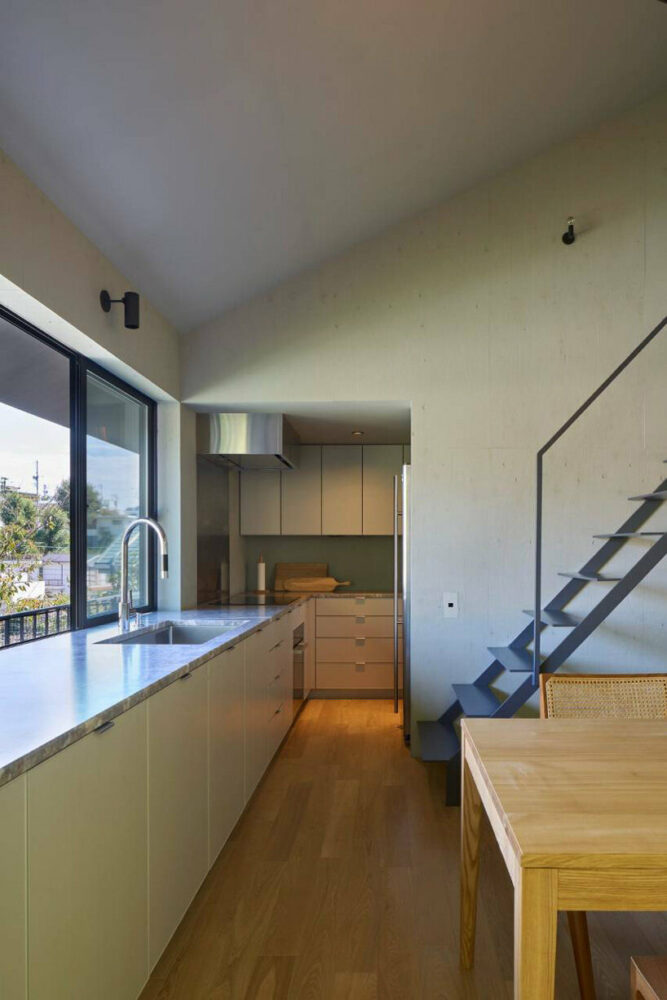 airhouse's wooden home floats above a steep slope in the japanese forest 