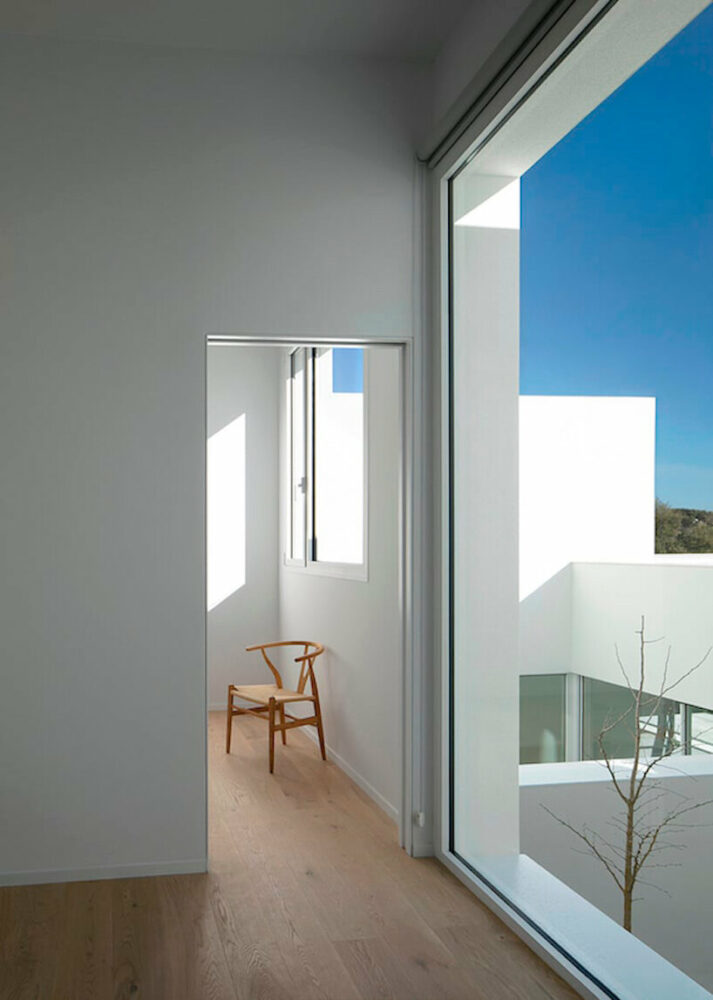 the purity of the geometry is reflected in the interior, while light and shadow filter through the compartments