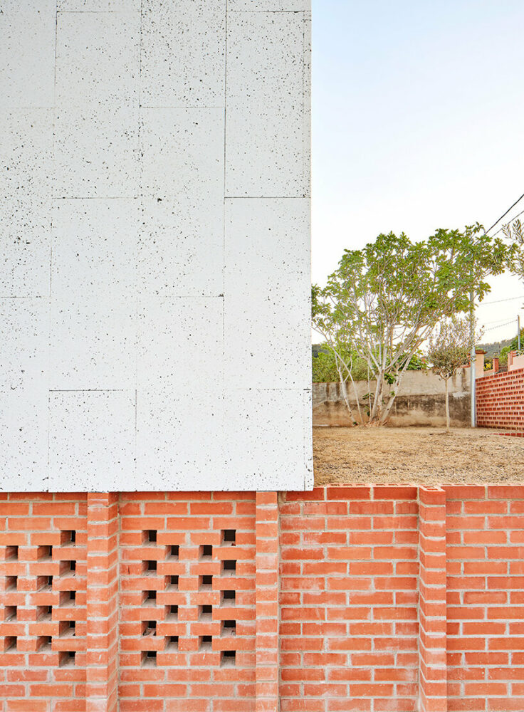 ágora arquitectura stacks cross laminated timber house atop old brick base in spain