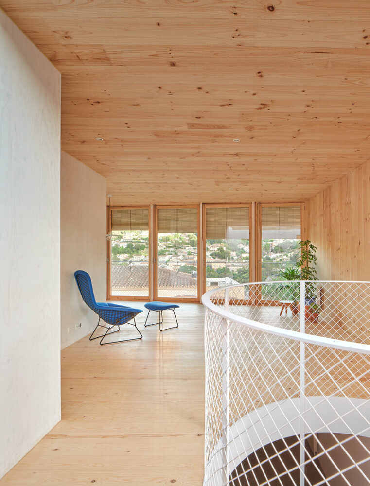 ágora arquitectura stacks cross laminated timber house atop old brick base in spain