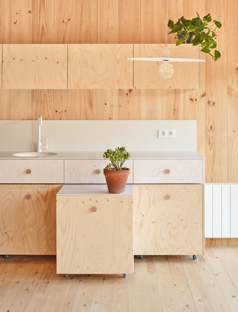 ágora arquitectura stacks cross laminated timber house atop old brick base in spain