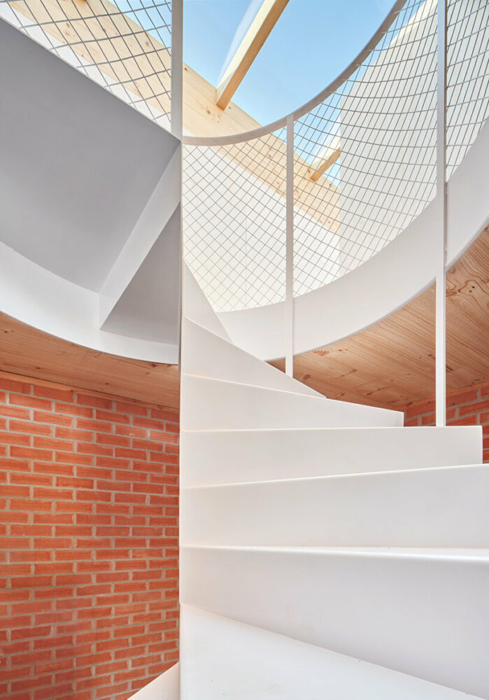 ágora arquitectura stacks cross laminated timber house atop old brick base in spain