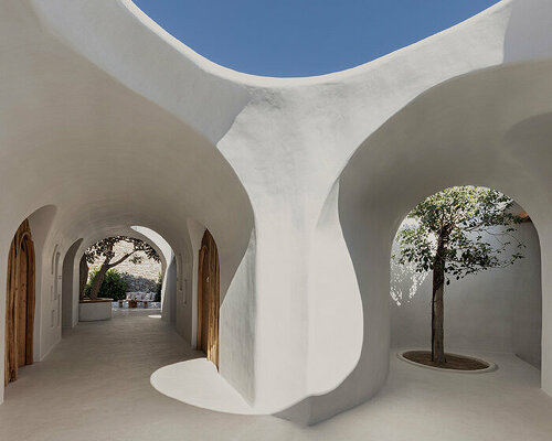 omniview's summer venue nods to cycladic aesthetic through organic forms and nooks