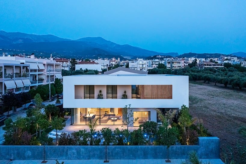 circular roof aperture sheds light through ‘frame house’ in greece
