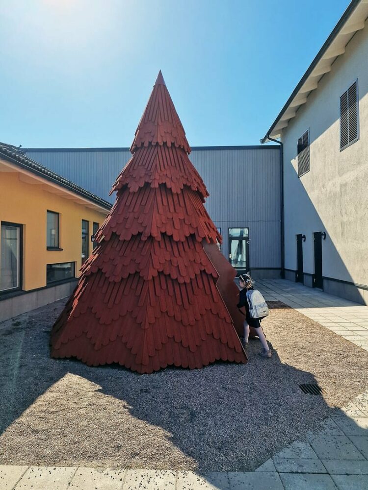UMA nestles children’s library inside spruce tree-shaped installation in sweden