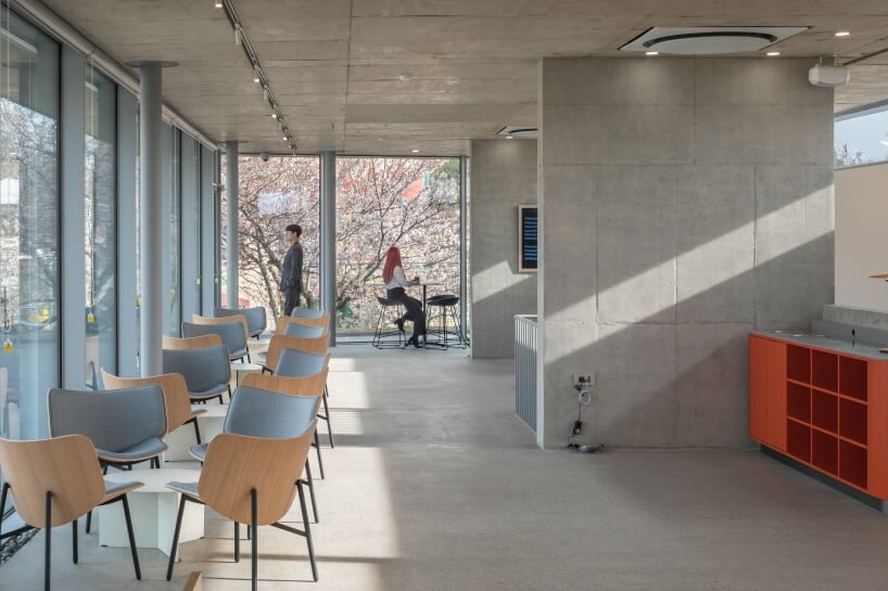 ‘in a little time café’ develops concrete promenade around central courtyard in korea