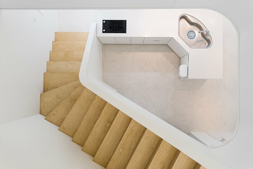 5F staircase overlooking the kitchen on the 4F