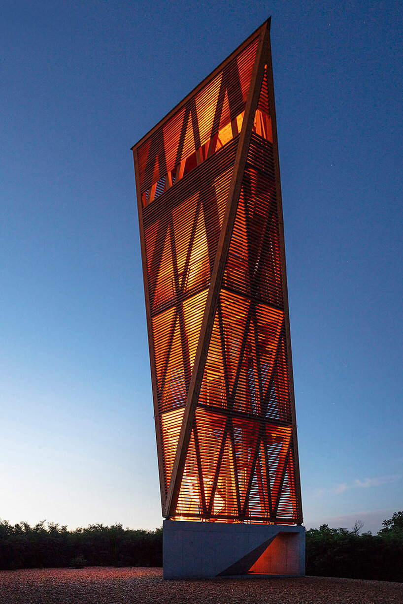 winding timber lookout tower rises above budapest's nature reserve