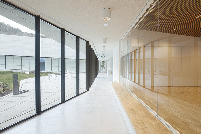 a folded stone roof crowns this visitor center in the spanish hillside