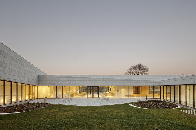 a folded stone roof crowns this visitor center in the spanish hillside