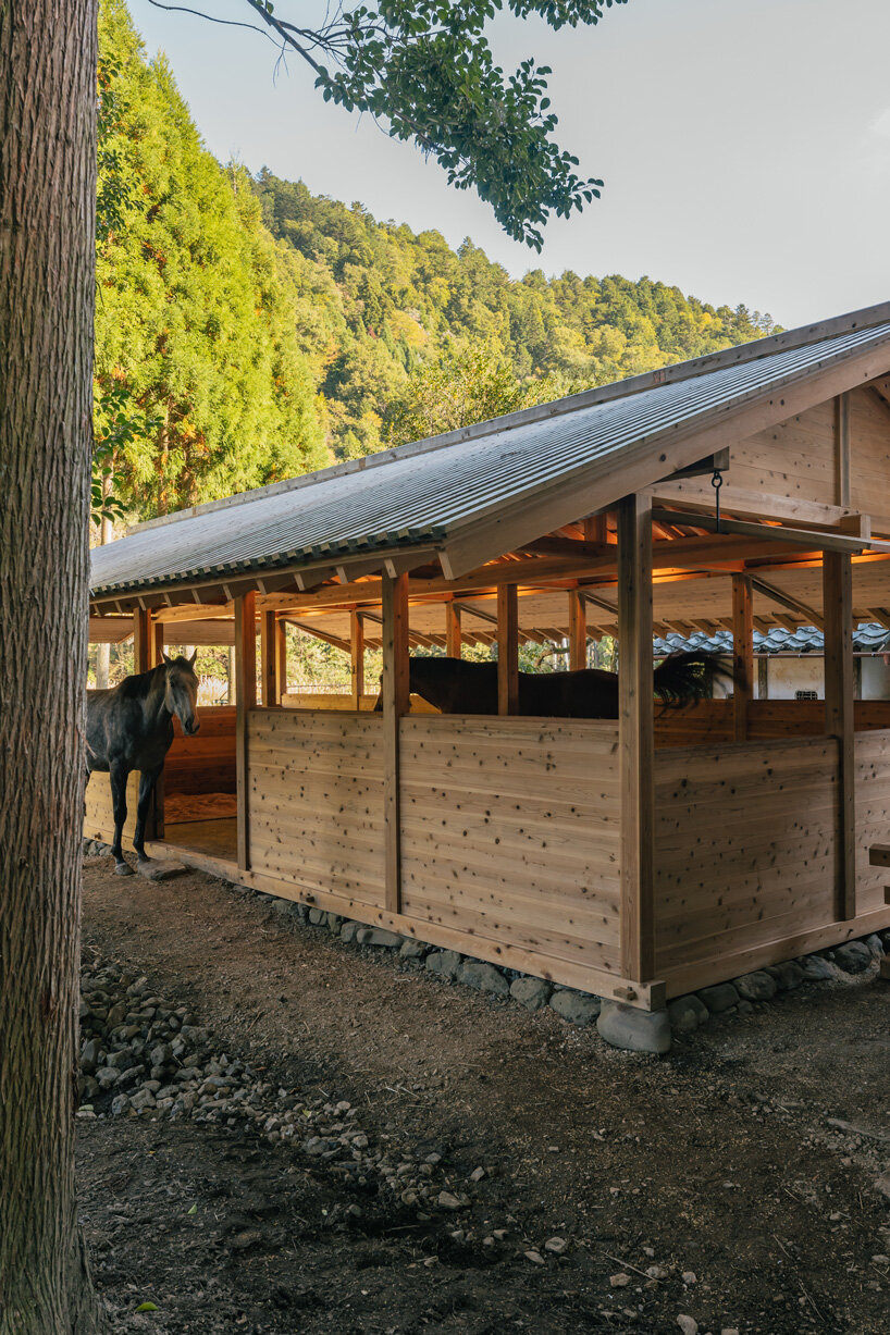 locally sourced wood and traditional japanese joinery shape 2m26's horse stable in kyoto