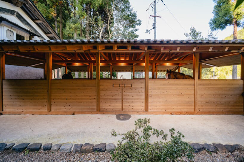 locally sourced wood and traditional japanese joinery shape 2m26's horse stable in kyoto