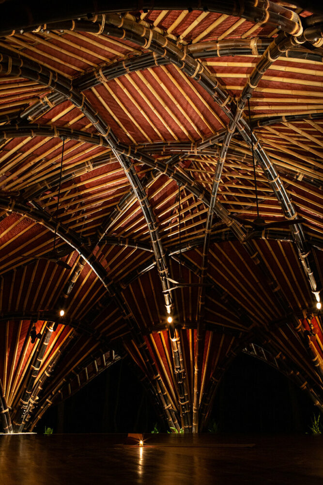IBUKU’s alchemy yoga center unfolds as two sculptural, copper-clad bamboo shalas in bali