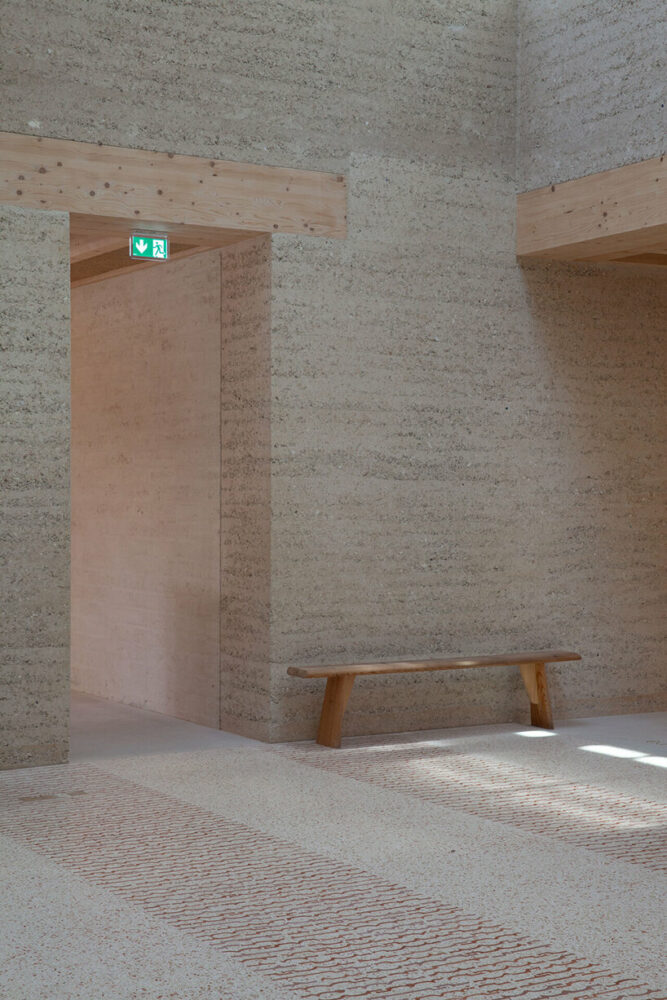Bloc B, Agora, with rammed rarth walls + reclaimed roof tile terrazzo floor, Le Magasin Électrique, LUMA Arles, France | image © Joseph Halligan