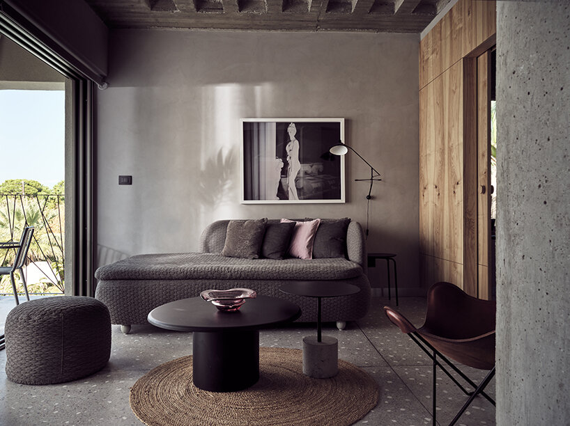 handcrafted, cave-like surfaces engulf ekies all senses resort’s redesigned suites in greece