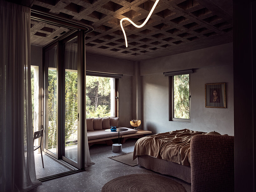 handcrafted, cave-like surfaces engulf ekies all senses resort’s redesigned suites in greece
