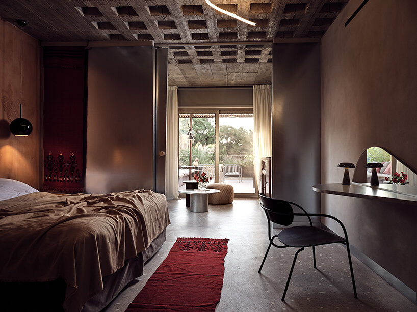 handcrafted, cave-like surfaces engulf ekies all senses resort’s redesigned suites in greece