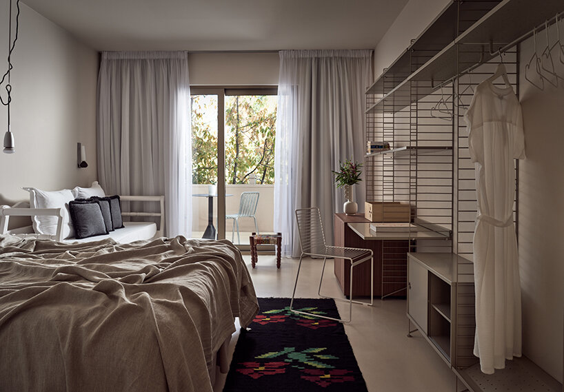 handcrafted, cave-like surfaces engulf ekies all senses resort’s redesigned suites in greece