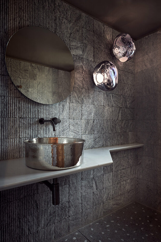 handcrafted, cave-like surfaces engulf ekies all senses resort’s redesigned suites in greece