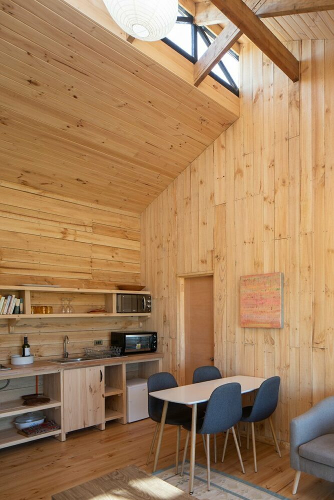 chilean home wraps in latticed semi-external corridor to combine private + commercial living