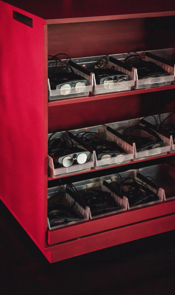 four cubic carts are placed within the perimeter of the circle, containing devices for the audience members