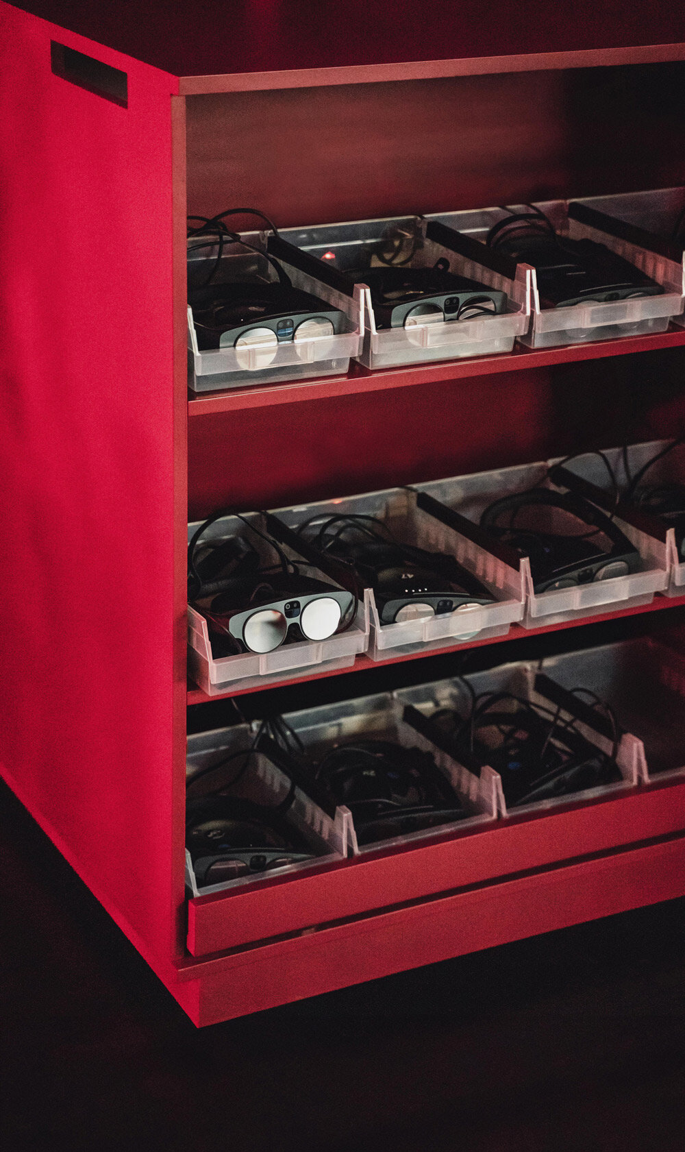 four cubic carts are placed within the perimeter of the circle, containing devices for the audience members