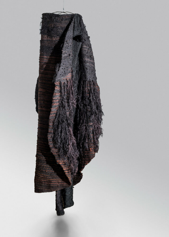 woven biomorphic sculptures by magdalena abakanowicz hover inside MCBA in switzerland