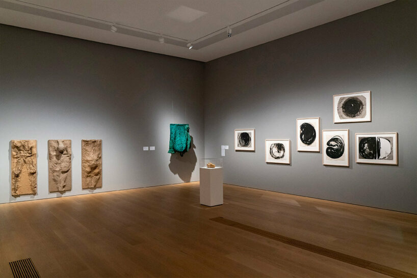 woven biomorphic sculptures by magdalena abakanowicz hover inside MCBA in switzerland