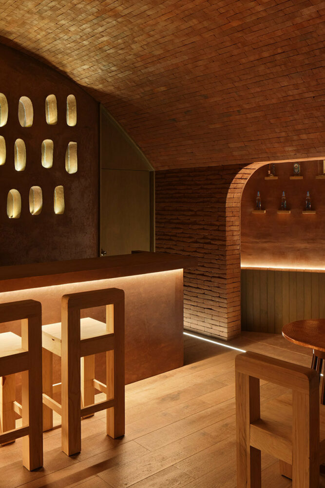 ‘el maguey’ mexican mezcal bar is designed with an earthy, underground atmosphere