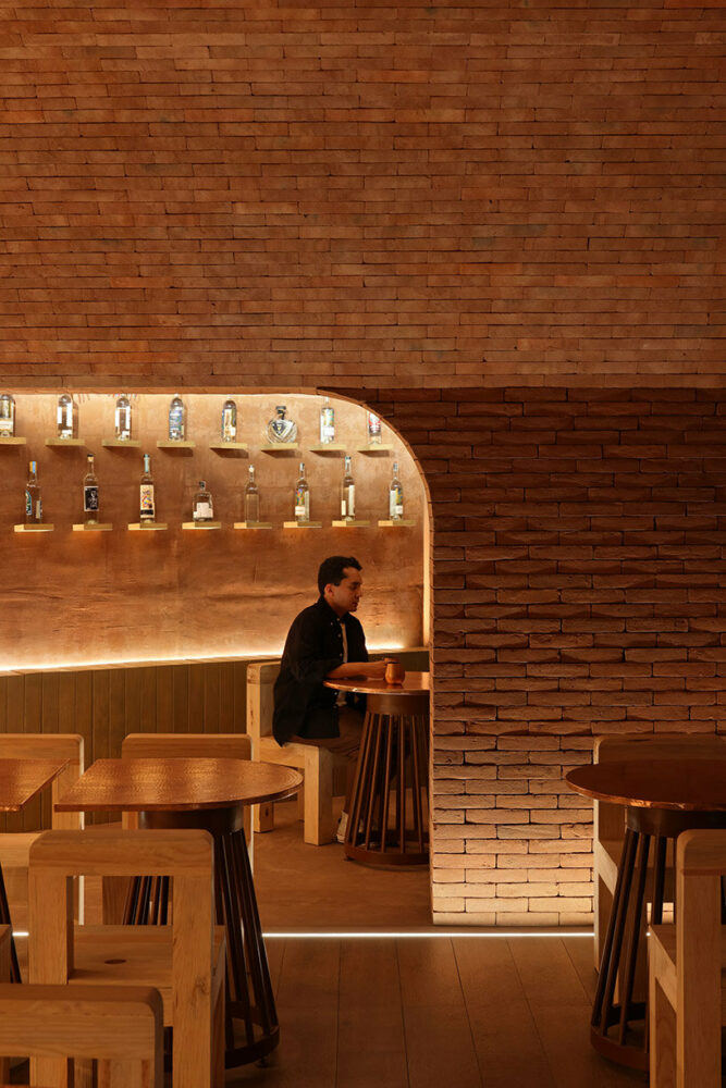 ‘el maguey’ mexican mezcal bar is designed with an earthy, underground atmosphere