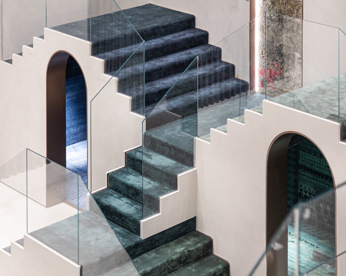 roar designs a captivating display of recurring stairs for jaipur rugs showroom in dubai