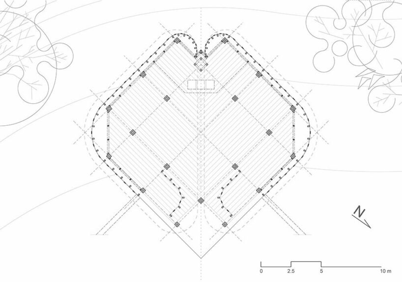 intricate timber latticework envelops st francis oratory amidst thailand’s serene landscapes