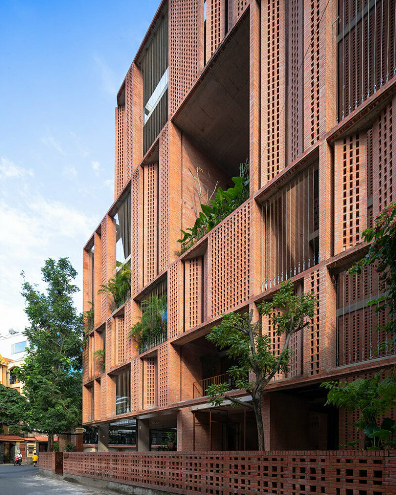 tropical space encloses this ‘premier office’ with a facade of porous brick shutters