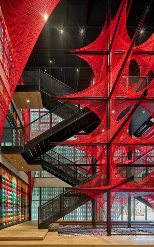 150,000 meters of vibrant red brocade threads compose immersive installation in china