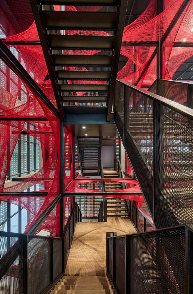 150,000 meters of vibrant red brocade threads compose immersive installation in china