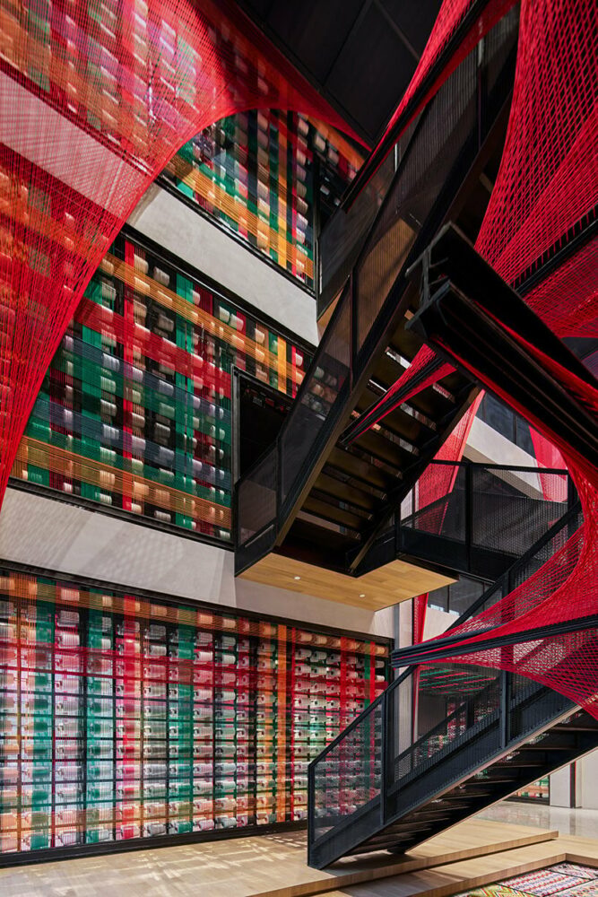 150,000 meters of vibrant red brocade threads compose immersive installation in china