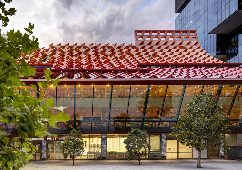 manuelle gautrand's tessellated roof drapes over phive civic center in parramatta, sydney 