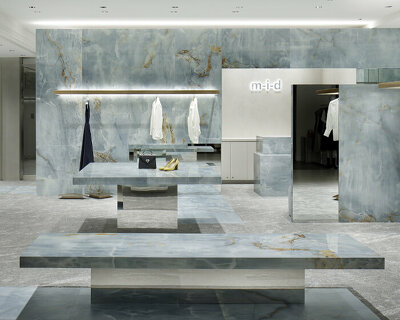 curiosity sculpts a blue labyrinth of onyx slabs inside m-i-d's concept store in kobe
