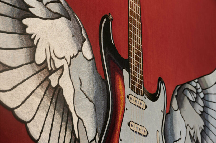 detail of the embroidered winged-guitar illustration, image © Taira Kurihara