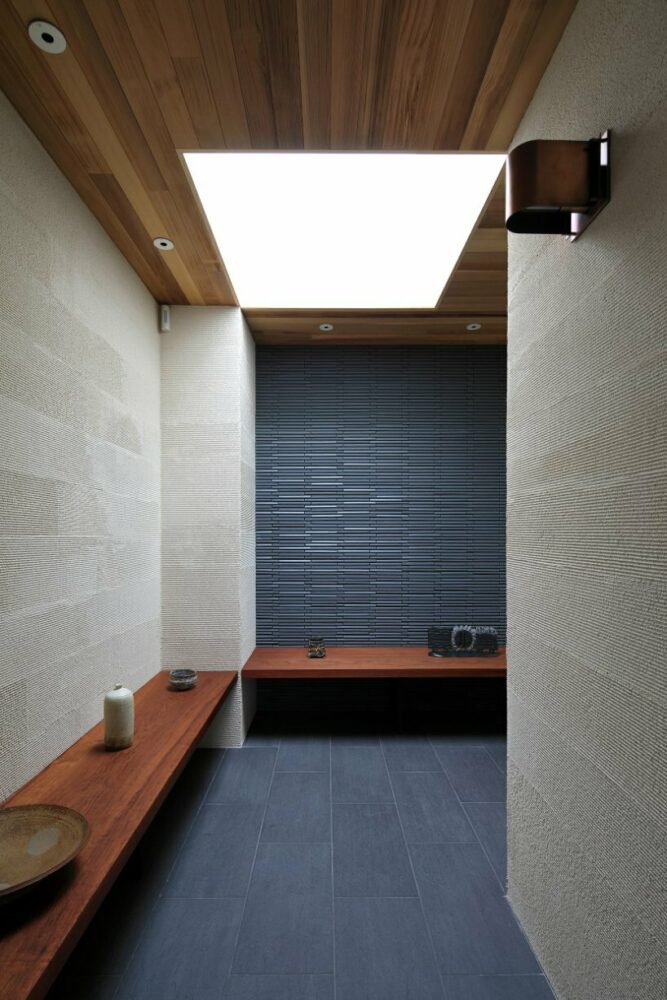 open courtyards embed natural greenery within the living spaces of residence in japan