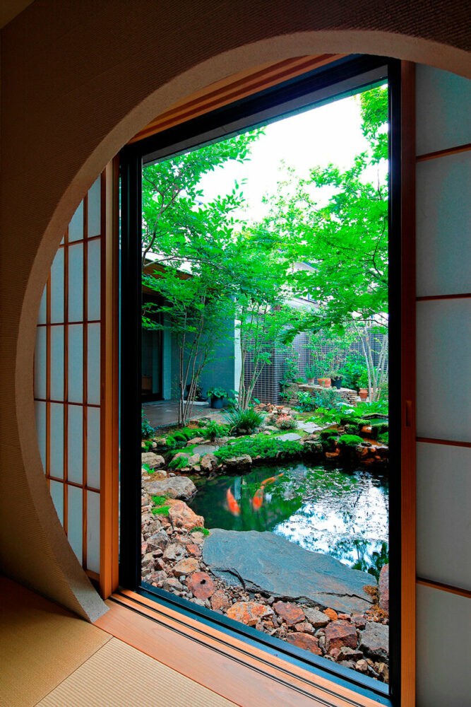 open courtyards embed natural greenery within the living spaces of residence in japan