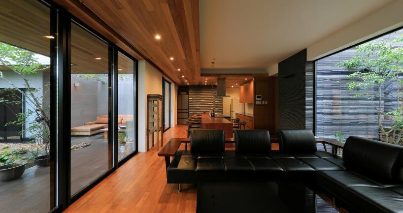 open courtyards embed natural greenery within the living spaces of residence in japan
