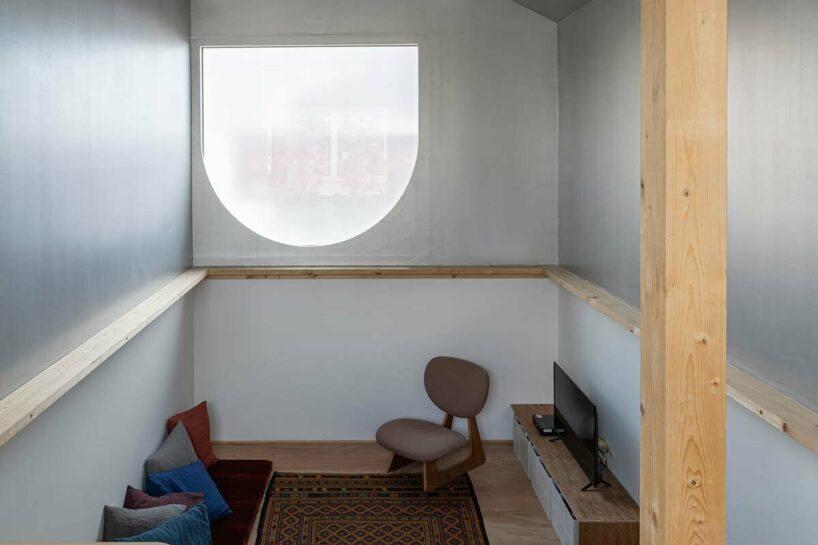 yoshichika takagi tops narrow dwelling in hokkaido with ‘greenhouse’ kitchen