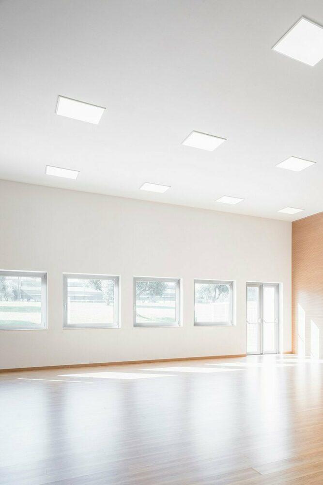 vibrant multipurpose room breathes new life into kindergarten in italy